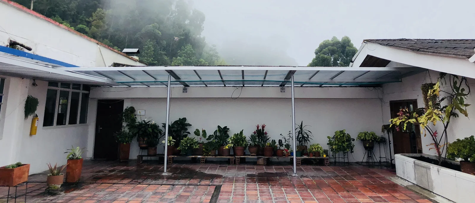 A white building with a covered walkway.