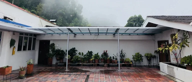 A white building with a covered walkway.